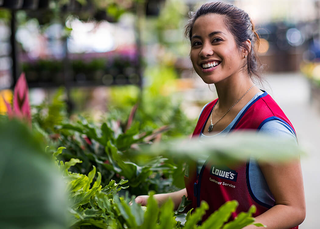 Female Lowes associate in plant department 